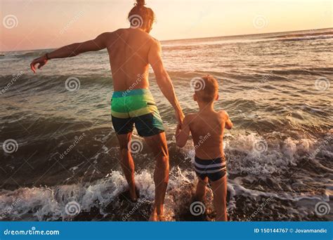 Father And Son Playing On The Beach Stock Image Image Of Nature Life