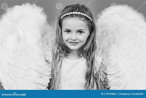 Wonderful Blonde Little Girl In The Image Of An Angel With White Wings