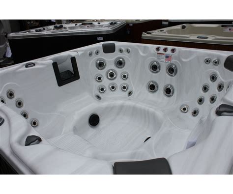 Cal Spas Coleman Series Hot Tub With Sterling Silver Interior And Preferred Smoke 75 Cabinet Cw