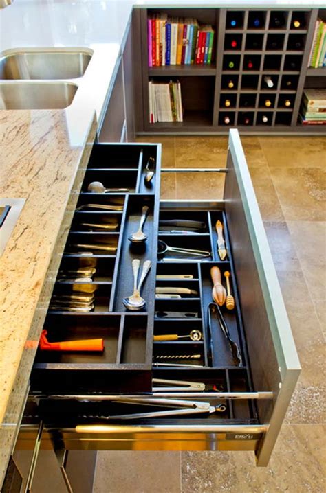 The stainless steel hood and exposed piping pop against the navy walls. 17 Clever and Creative Utensil Storage Ideas