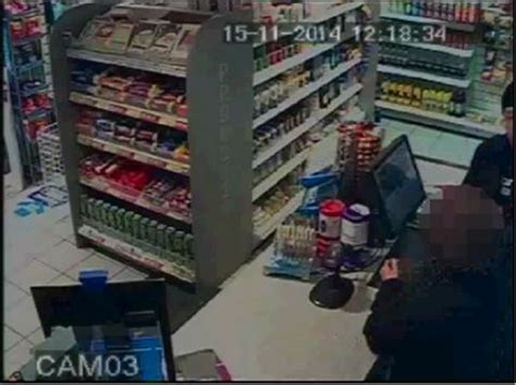 Watch Moment Armed Robber Holds Knife To Throat Of Terrified Shop