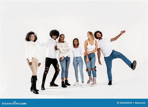 Group Of Multiracial Happy Friends Smiling To The Camera Stock Photo