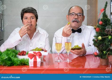Senior Couple Celebrating New Year Eating Grapes Spanish New Year