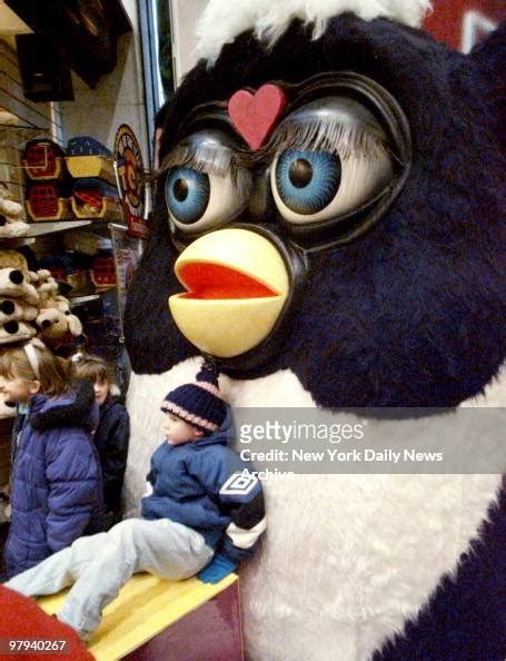 Youngster Gets Close To A Giant Furby On Display In Fao Schwarz Toy
