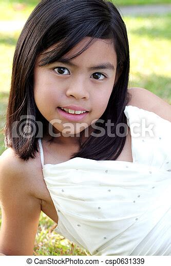 eight year old asian girl outdoors canstock