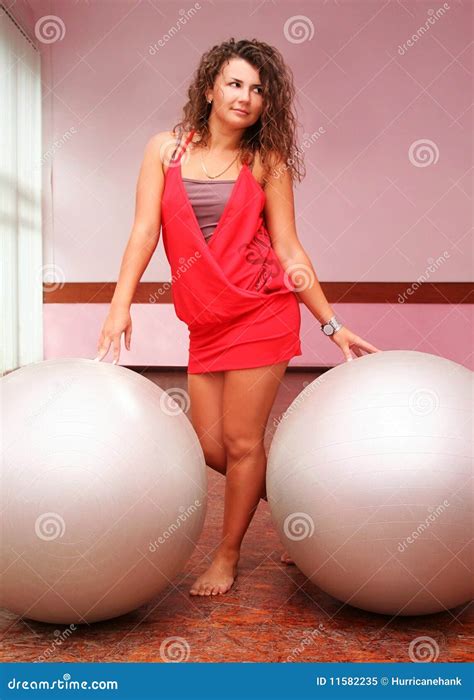 Young Girl In Red Dress With Two Fitness Balls Stock Image Image Of