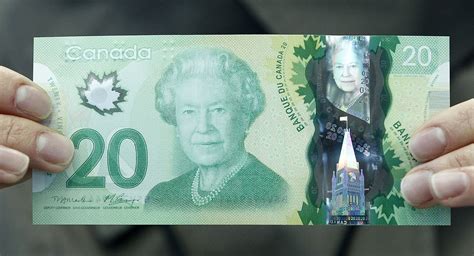 Canadians Are Cutting 20 Bills In Half To Make Two 10s Time