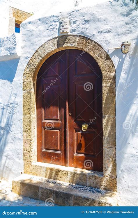 Ancient Greek Architecture With Traditional Doors And Decorative