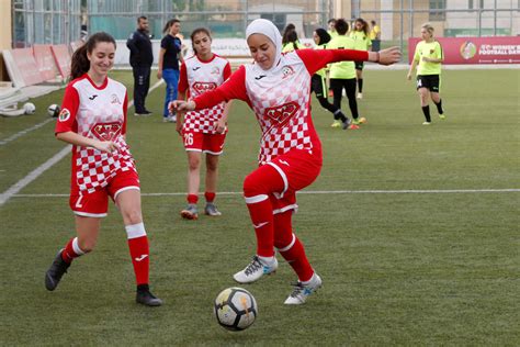 soccer players help hijab wearing opponent in faith restoring act of sportsmanship