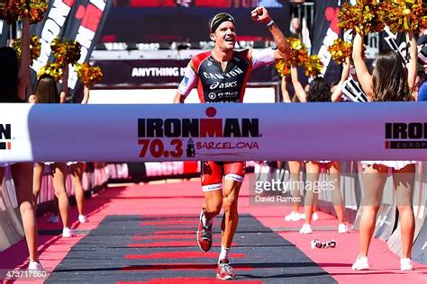 Jan Frodeno Of Germany Crosses The Finish Line To Win Ironman 703 On