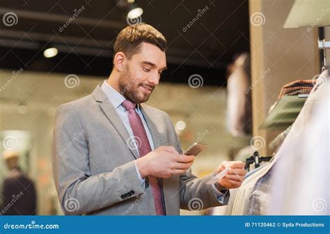Man In Suit With Smartphone At Clothing Store Stock Photo Image Of
