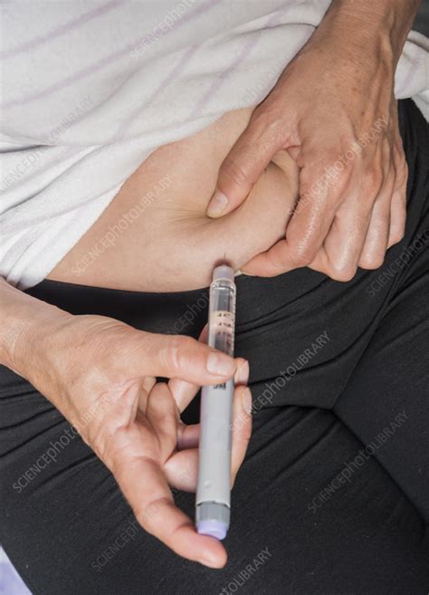 Woman Injecting Insulin Into Her Abdomen Stock Image F0371288