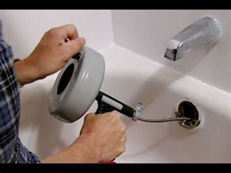 Clear the standing water from the bathroom and remove all the debris at the drain opening. How to Clear a Clogged Bathtub Drain - This Old House # ...