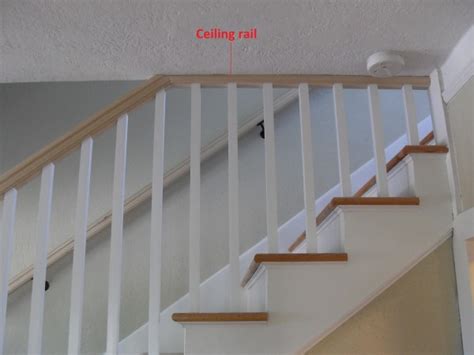 Installing a railing to a narrow staircase will give added security for anyone using stairs. Ceiling Rail | Portland Stair Company