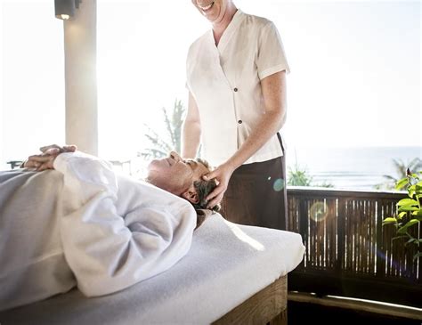 female massage therapist giving a massage photo rawpixel