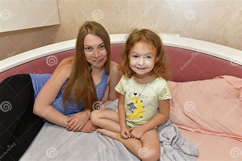 Aunt Puts Her Niece To Sleep In Bed Stock Image Image Of Laughing