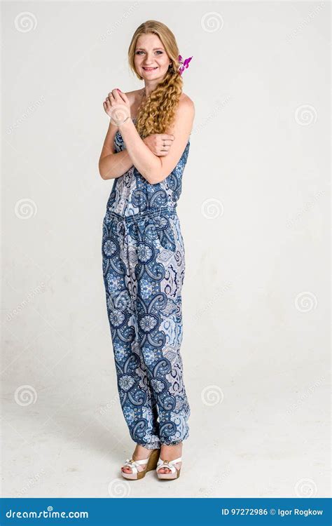 Beautiful Romantic Girl Blonde In Summer Dress With Orchid Flower Stock