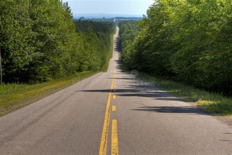 Long Straight Road Through Hilly Terrain Stock Photo Image Of Nature