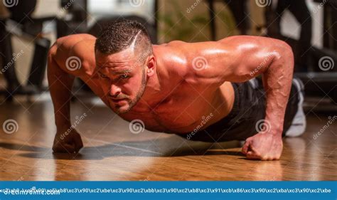 Muscular And Strong Guy Exercising Slim Man Doing Some Push Ups A The