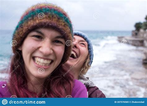two girls laugh on the beach while walking stock image image of friendship lgbtq 207576565