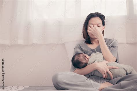 Tired Mother Suffering From Experiencing Postnatal Depression Health