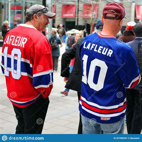 People With Jersey 10 Lafleur Waiting For Burning Chapel Of Late Guy
