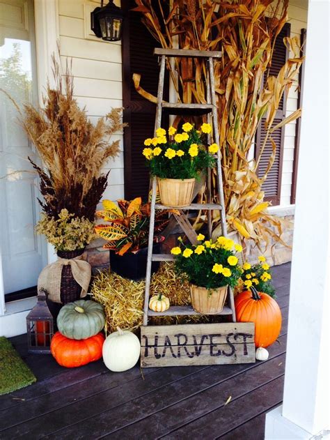 Front porch decorated for the halloween, thanksgiving, autumn season. 57 Cozy Thanksgiving Porch Décor Ideas - DigsDigs
