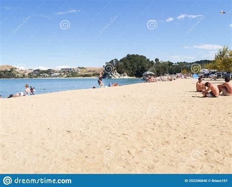 People Enjoying Summer At Golden Bay Beach Sunbathing And Swimming Editorial Image Image Of