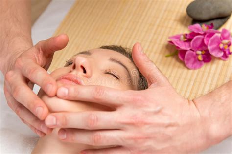 male hands of the masseur cosmetologist doing massage the girl stock image image of