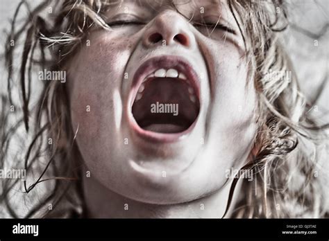 Girl Is Shouting With Gaping Mouth Stock Photo Alamy