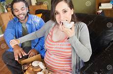 pregnant couple hungry greedy women stock