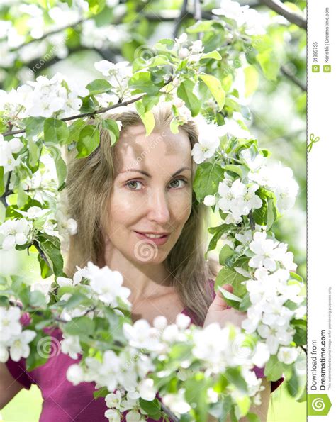 Young Attractive Woman Standing Near The Blossoming Apple Tree Stock Image Image Of Outsides