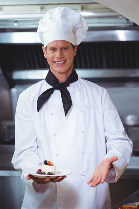 Proud Chef Holding A Plate Of Cheesecake Desert Stock Photo Image Of