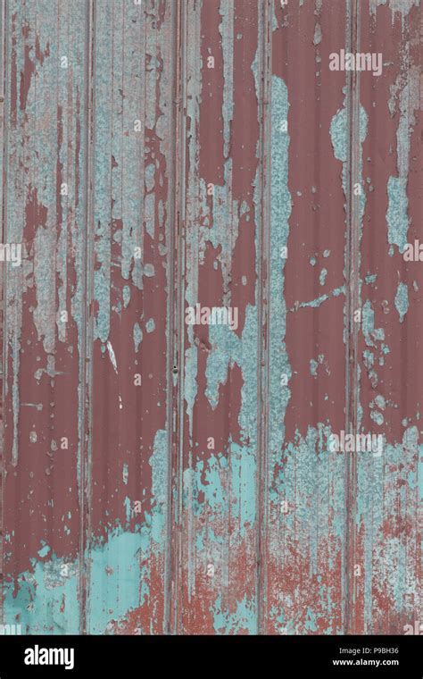 Faded Peeling Rusty Steel Sheets With Oxblood Red Paint Grunge