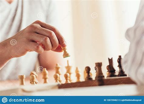 Cropped Shot Of Man Moving Chess Figure Stock Photo Image Of Casual