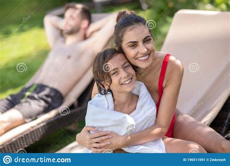 Happy Mom With Son Sitting On Lounger On Lawn Stock Image Image Of