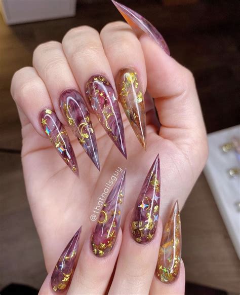 These gorgeous long stilettos nails will make everyone ask to see your
