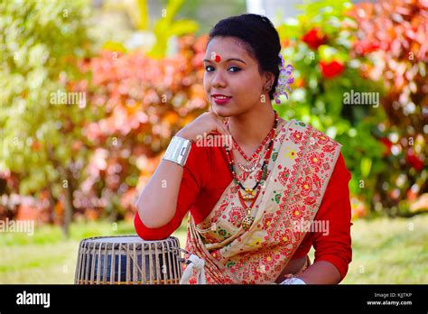Assamese Girl In Traditional Attire Posing With A Dhol Drum Pune