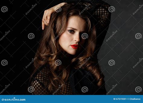 Portrait Of Woman With Long Curly Brown Hair And Red Lips Stock Image