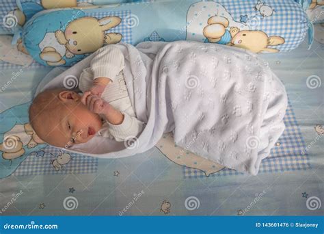 A Newborn Sleeps In His Crib Man Was Born Stock Photo Image Of