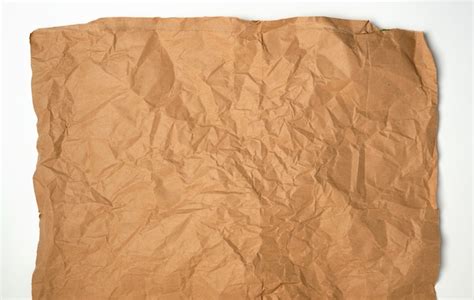 Premium Photo Crumpled Piece Of Brown Paper Sheet