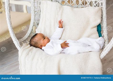 3 Month Old African American Baby Boy Lay In Armchair Stock Photo