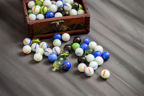 Being A Child Is Playing A Marble The Colors Are Colored Marbles