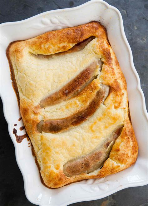 Remove the hot roasting tin from the oven and add the sausages, apple wedges. Classic English Toad-in-the-Hole Recipe | SimplyRecipes.com