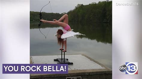 Young Contortionist Shoots A Bow And Arrow With Her Feet