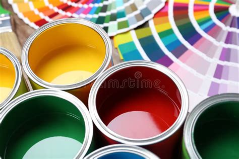 Paint Cans And Color Palette Samples On Table Editorial Photography