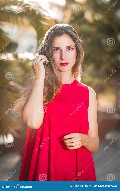 Fashion Portrait Of A Beautiful Woman In Red Dress Stock Photo Image