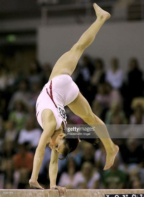 Maybe you would like to learn more about one of these? Vanessa Ferrari of Italy performs on the beam in the ...