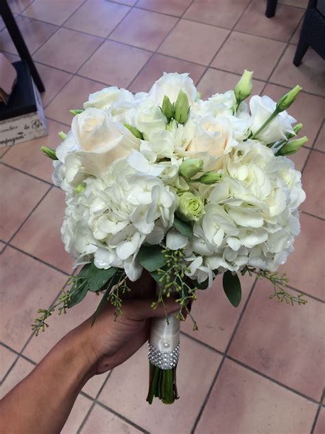 all white bouquet with hydrangea lisianthus and vandella roses hydrangea bouquet wedding