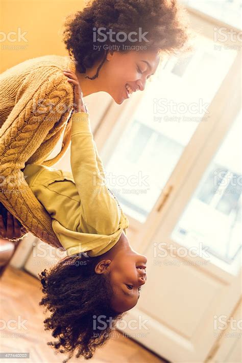 Playful African American Mother And Daughter Having Fun At Home Stock